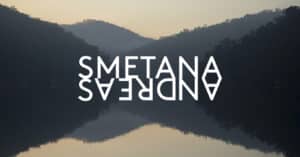 a Tranquil Lake at Dusk with Dark Hills on Either Side and a Pale Sunset; Oversized White Text 'smetana' Mirrored Upside Down Across the Center.